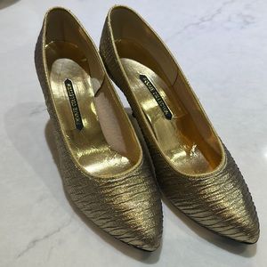 Gold pumps just in time for new years.  Size 7 1/2 B. 3” heels